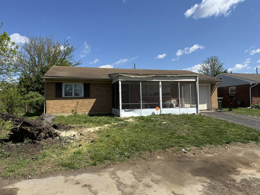 Same yard after the downed tree was removed and the area was fully cleaned up